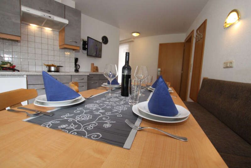 Kitchen with dining area in flat 3 at Apart Gruber in Ischgl