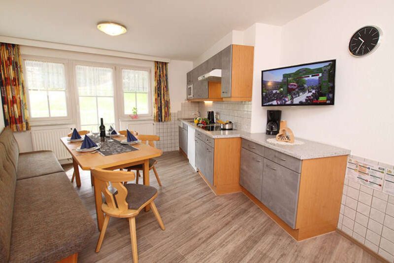 Kitchen with dining area in apartment 3 at Apart Gruber in Ischgl