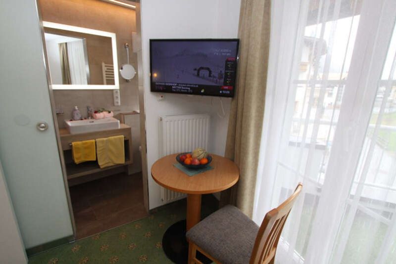 Sitting area with balcony door in apartment 3 in Apart Gruber