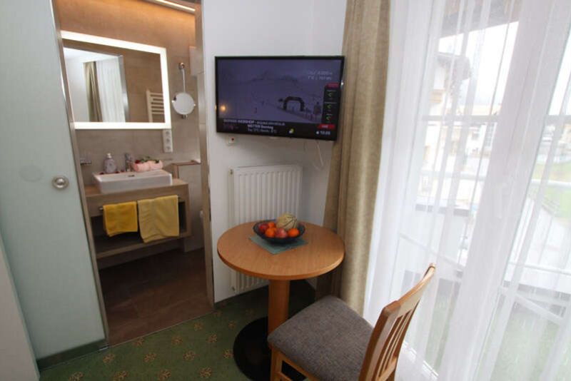 Sitting area with balcony door in apartment 3 in Apart Gruber